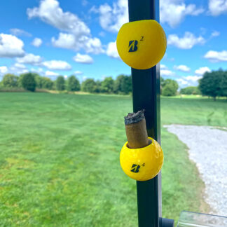 Yellow Bridgestone pair of Cigar Balls attached to golf cart