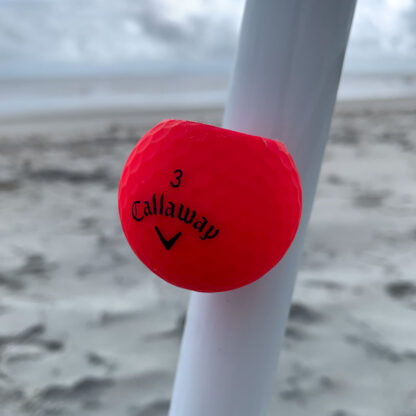 Red Cigar Ball on the umbrella at the beach